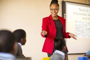 A clear photo of a teacher handling grade 5 learners in a school in Central Kenya, February 2023