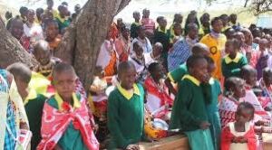 A clear photo of learners attending class beneath a tree shade in a school in Noth Eastern Kenya